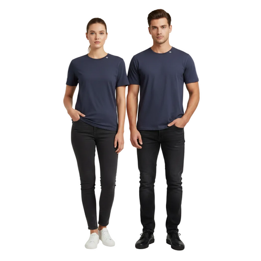 A man and a woman modeling matching navy blue merino wool short-sleeve crewneck t-shirts, paired with black jeans and white sneakers, standing against a light gray studio background.